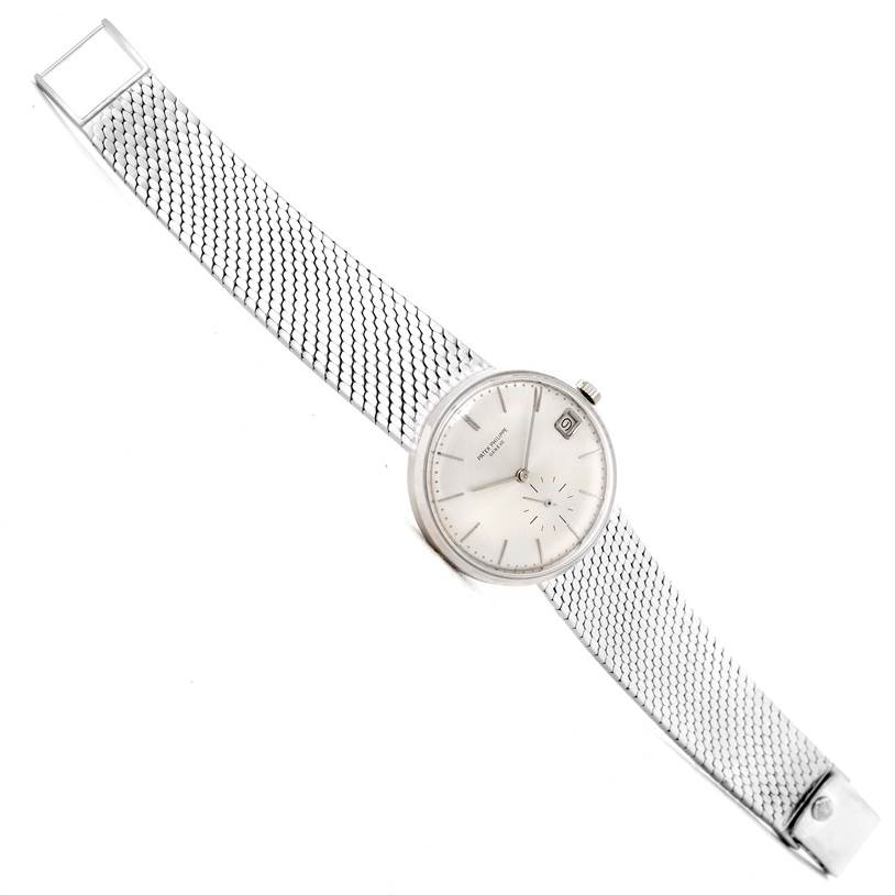 This image shows a Vintage Patek Philippe watch with a silver mesh bracelet, viewed from a top-down angle.