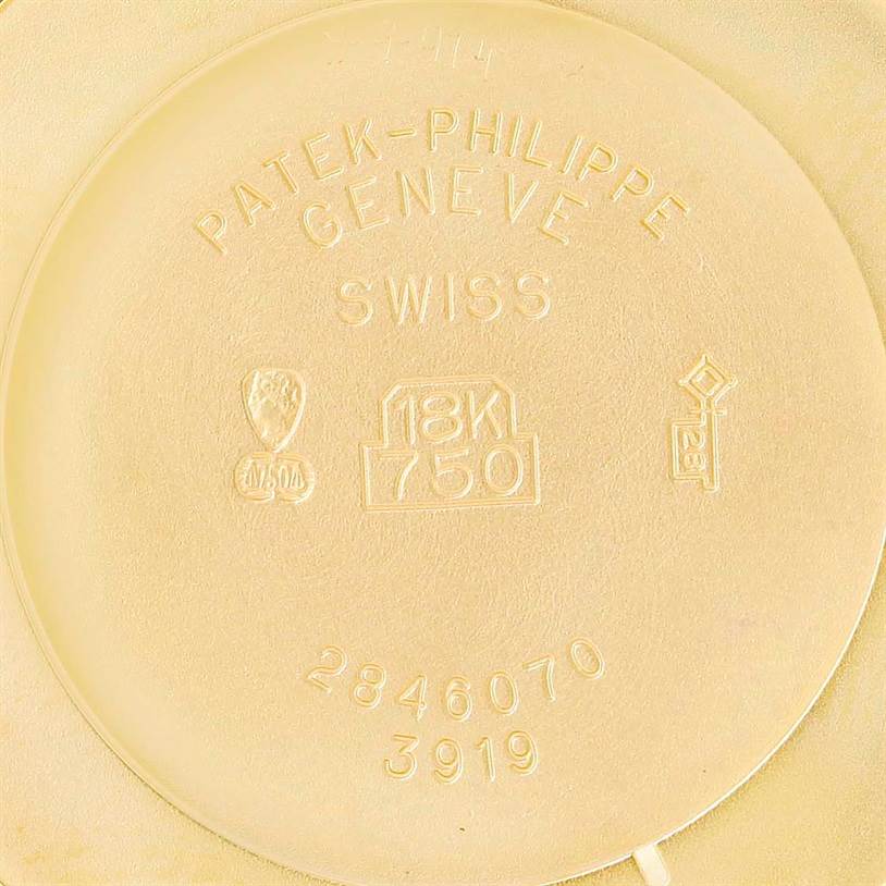 The image shows the interior case back of a Patek Philippe Calatrava 3919 Men's Yellow Gold White Dial 3919 Men's Yellow Gold White Dial model watch, engraved with the brand, hallmark, and model details.