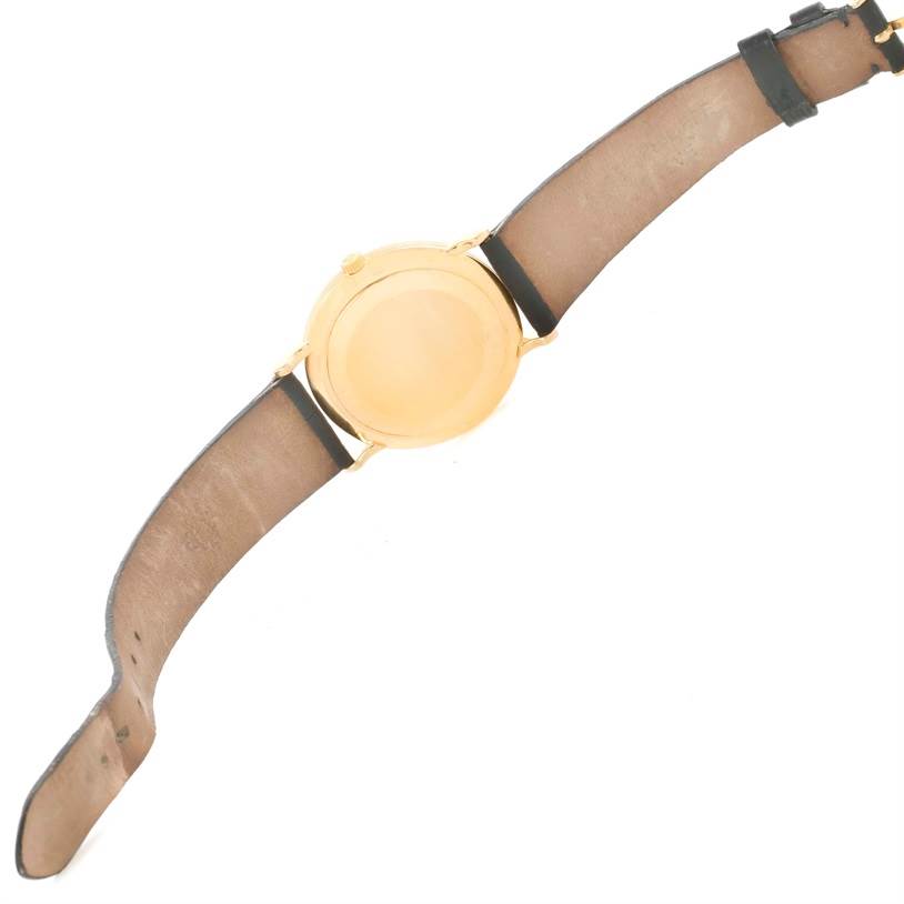 The image shows the back view of a Patek Philippe Calatrava 3919 Men's Yellow Gold White Dial 3919 Men's Yellow Gold White Dial watch, displaying the case back and leather straps.