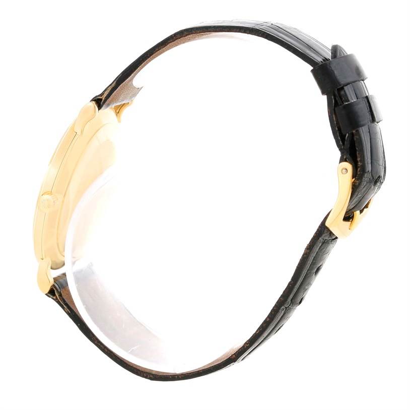 The image shows a side view of a Patek Philippe Calatrava 3919 Men's Yellow Gold White Dial 3919 Men's Yellow Gold White Dial watch, highlighting its case, strap, and buckle.