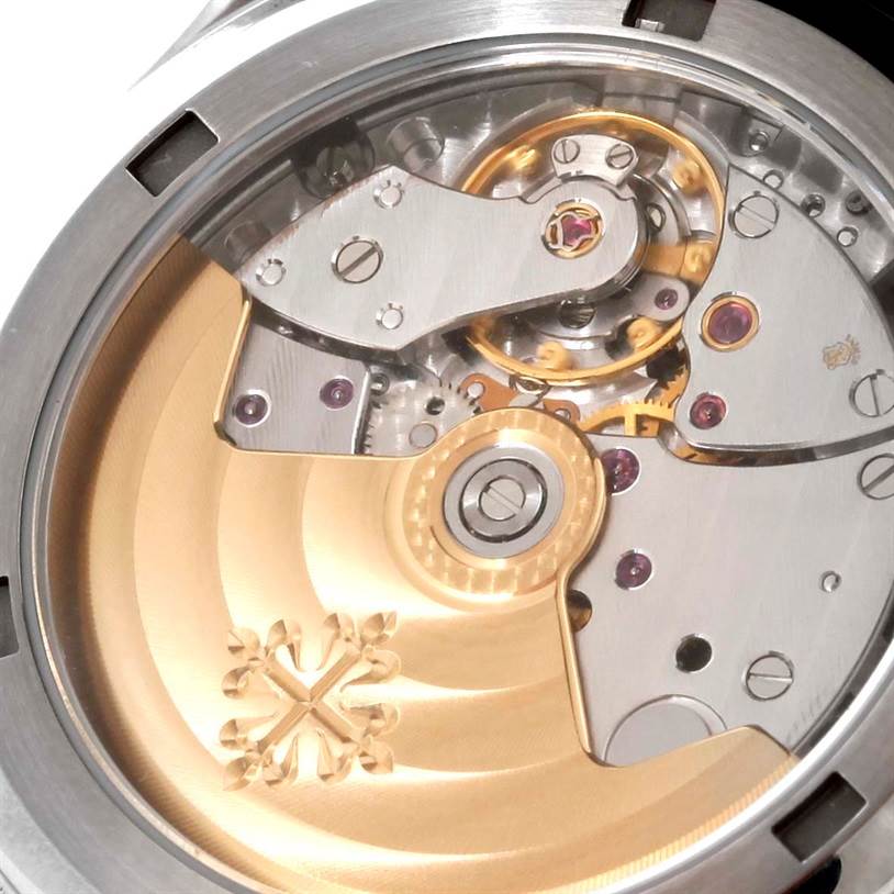 The image shows a close-up of the movement and internal mechanical parts of the Patek Philippe Aquanaut 5066A Men's Stainless Steel Black Dial 5066A Men's Stainless Steel Black Dial watch.