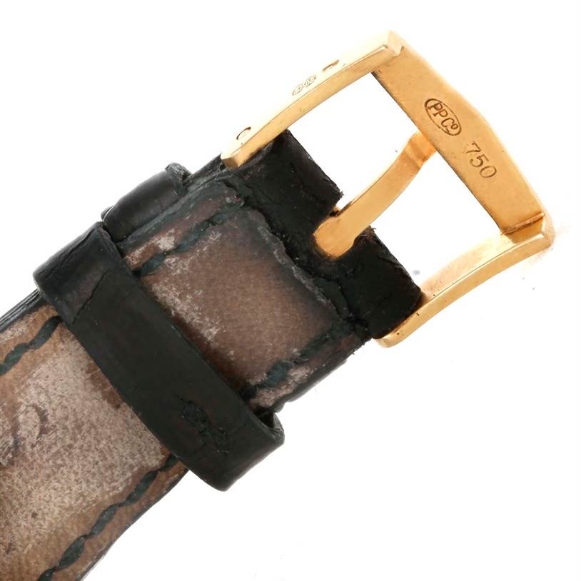 The image shows a close-up of the strap and gold buckle of a Patek Philippe Calatrava 3802 Men's Yellow Gold White Dial 3802 Men's Yellow Gold White Dial watch.