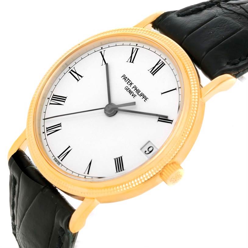 This image shows a Patek Philippe Calatrava 3802 Men's Yellow Gold White Dial 3802 Men's Yellow Gold White Dial watch from a three-quarter angle, highlighting the face, bezel, and part of the strap.