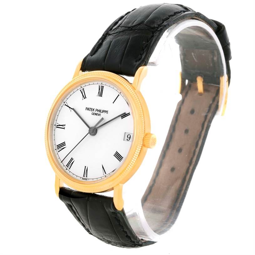 The image shows a Patek Philippe Calatrava 3802 Men's Yellow Gold White Dial 3802 Men's Yellow Gold White Dial watch at an angle displaying the face, bezel, crown, and black leather strap.