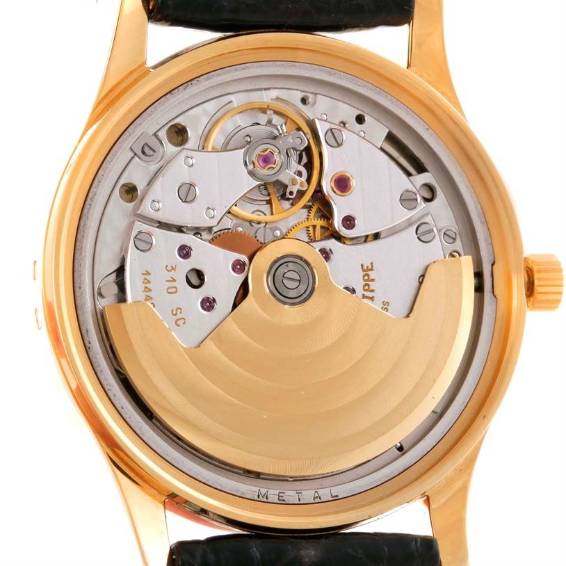 This image shows the back view of a Patek Philippe Calatrava 3998 Men's Yellow Gold Silver Dial 3998 Men's Yellow Gold Silver Dial watch, revealing the intricate movement and rotor.