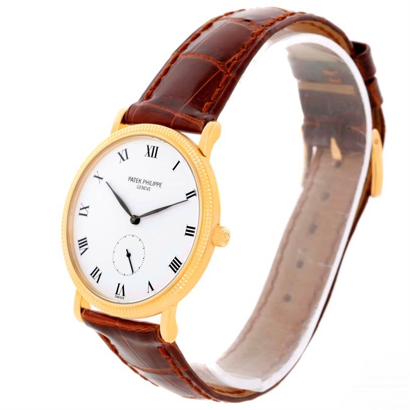 The image shows a Patek Philippe Calatrava 3919 Men's Yellow Gold White Dial 3919 Men's Yellow Gold White Dial watch from a three-quarter angle, highlighting its face, strap, and crown.