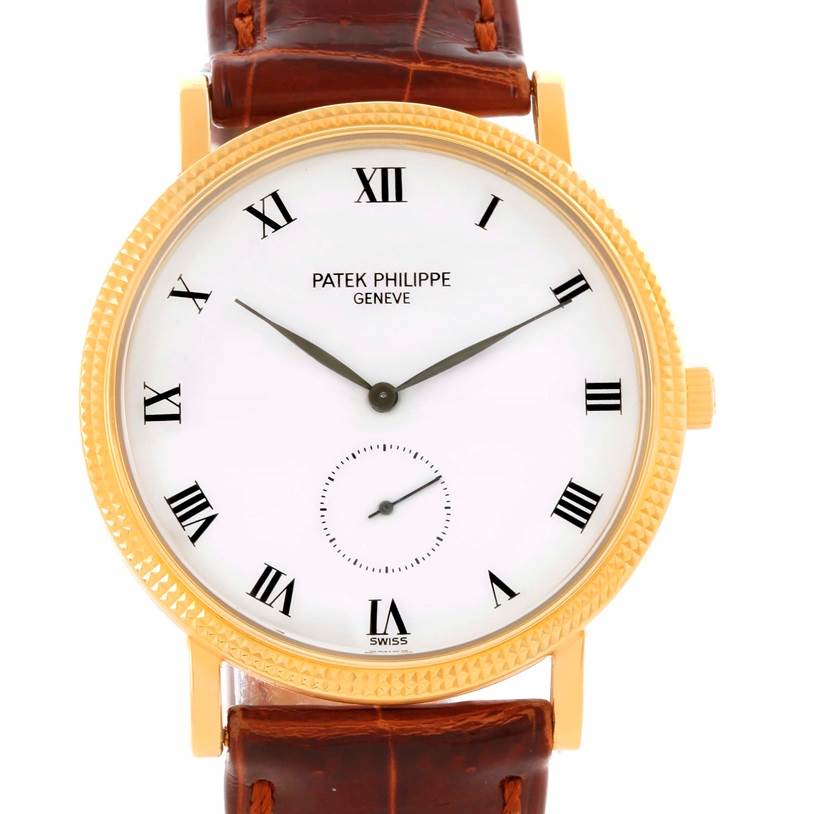 This image shows a front view of a Patek Philippe Calatrava 3919 Men's Yellow Gold White Dial 3919 Men's Yellow Gold White Dial watch with a white dial, Roman numerals, and a brown leather strap.