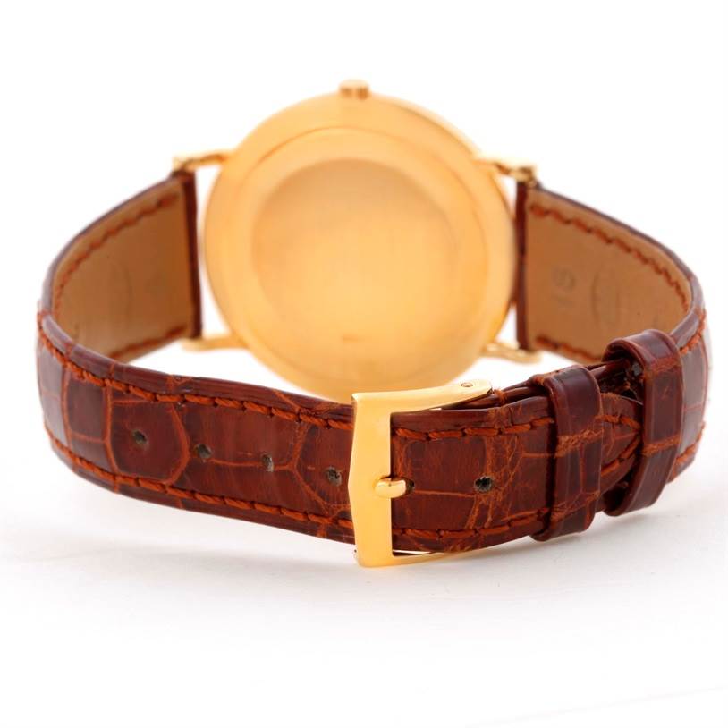 This image shows the back view of the Patek Philippe Calatrava 3919 Men's Yellow Gold White Dial 3919 Men's Yellow Gold White Dial watch, highlighting its case back and brown leather strap with a gold buckle.