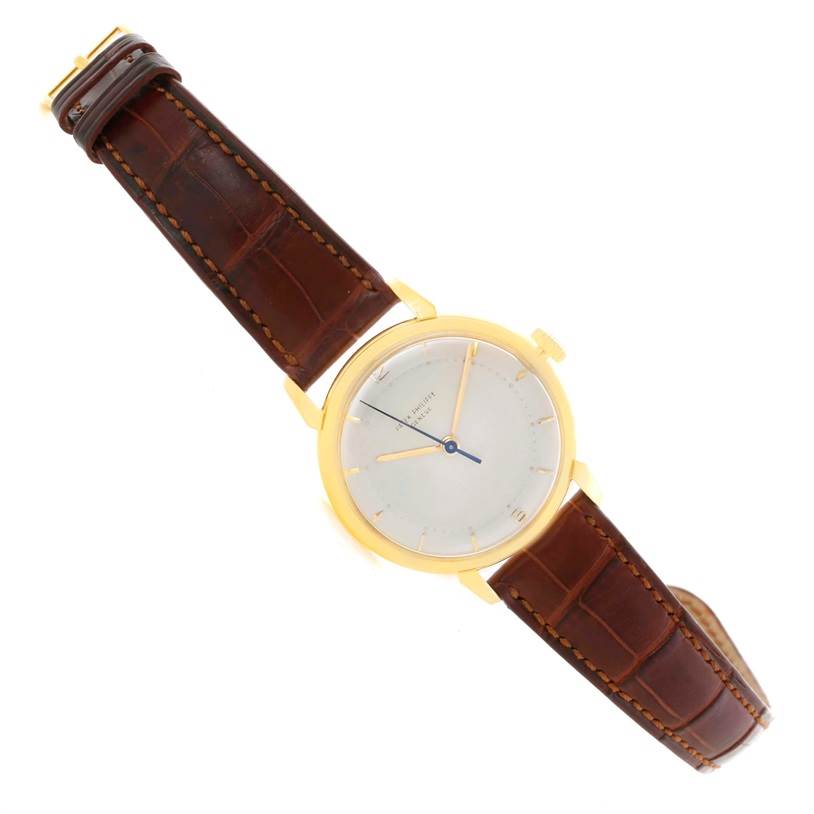 The image shows a Patek Philippe 2482 Yellow Gold Silver Dial 2482 Yellow Gold Silver Dial Calatrava 18k Yellow Gold Men
s Vintage Watch 2482 model from an angled top view, highlighting the dial and leather strap.