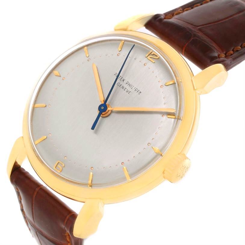 The image shows a close-up, angled view of the dial and case of a Patek Philippe 2482 Yellow Gold Silver Dial 2482 Yellow Gold Silver Dial Calatrava 18k Yellow Gold Men
s Vintage Watch, model 2482.