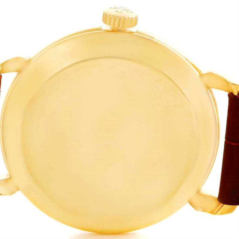 This image shows the back case and crown of the Patek Philippe 2482 Yellow Gold Silver Dial 2482 Yellow Gold Silver Dial Calatrava 18k Yellow Gold Mens Vintage Watch 2482 model.