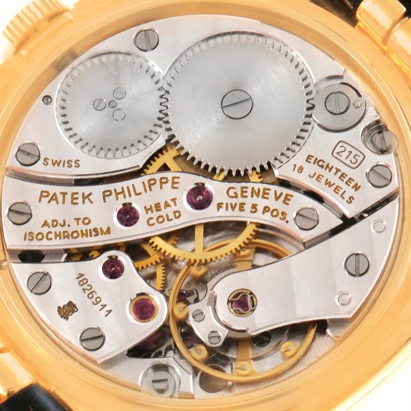 The image displays the intricate inner mechanism of the Patek Philippe Golden Ellipse 3948 Men's Yellow Gold White Dial 3948 Men's Yellow Gold White Dial watch, highlighting gears and jewels.