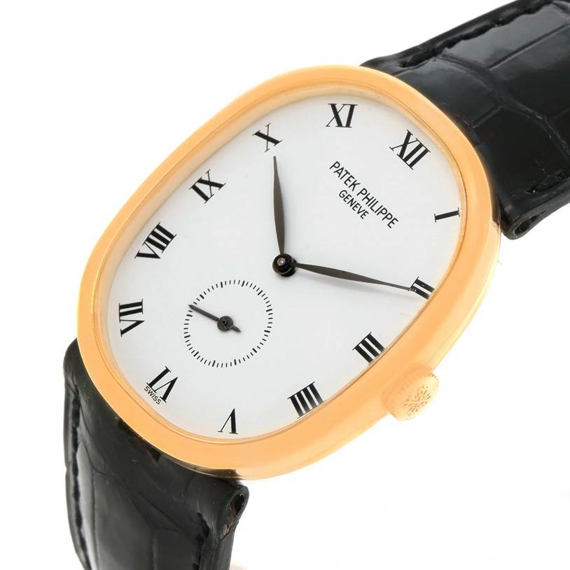 The image shows a side angle view of the Patek Philippe Golden Ellipse 3948 Men's Yellow Gold White Dial 3948 Men's Yellow Gold White Dial watch, highlighting the dial, crown, and part of the strap.