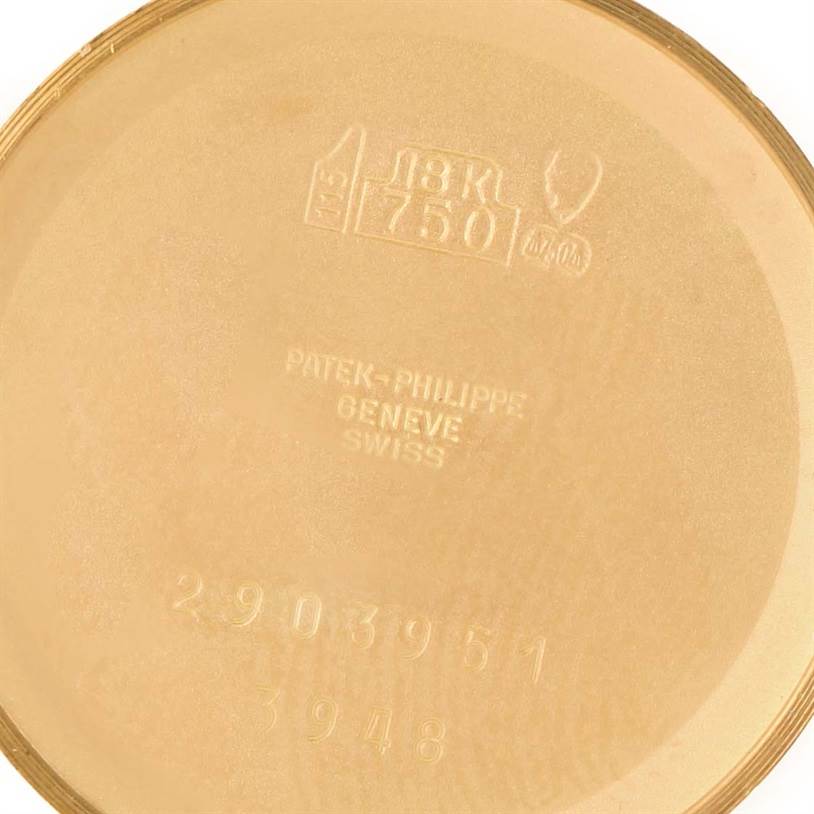 The image shows the inner case back of a Patek Philippe Golden Ellipse 3948 Men's Yellow Gold White Dial 3948 Men's Yellow Gold White Dial watch, stamped with details such as "18K 750" and serial numbers.