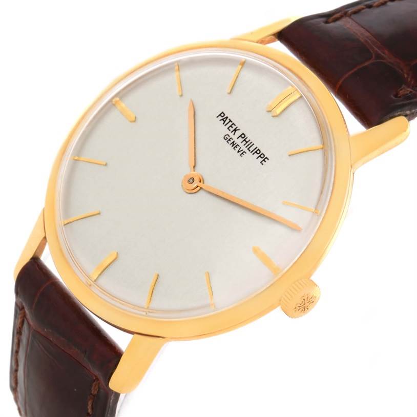 This image shows a Patek Philippe Vintage model watch angled to the right, displaying its face, crown, and part of the leather strap.