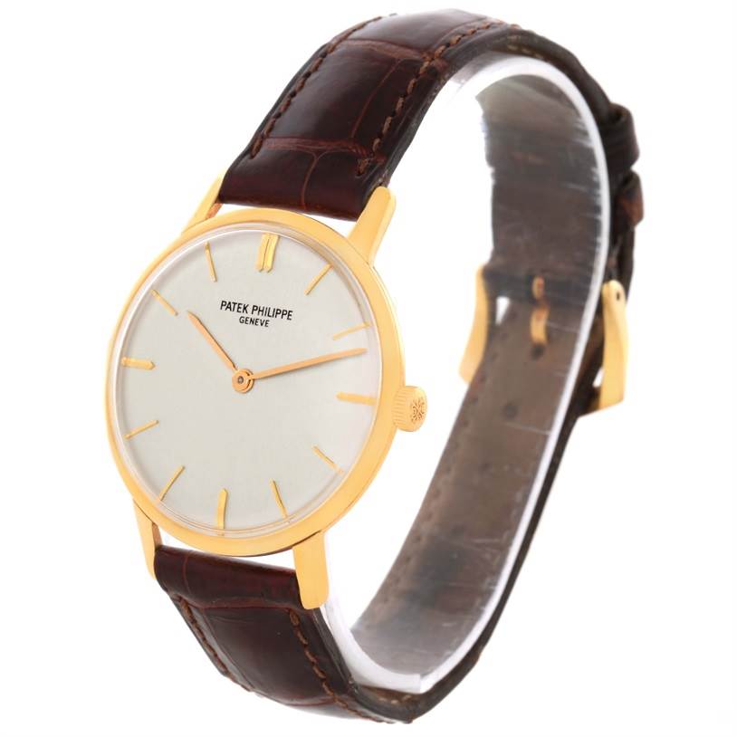 This image shows a Patek Philippe Vintage watch from an angled side view. The face, strap, and crown are visible.