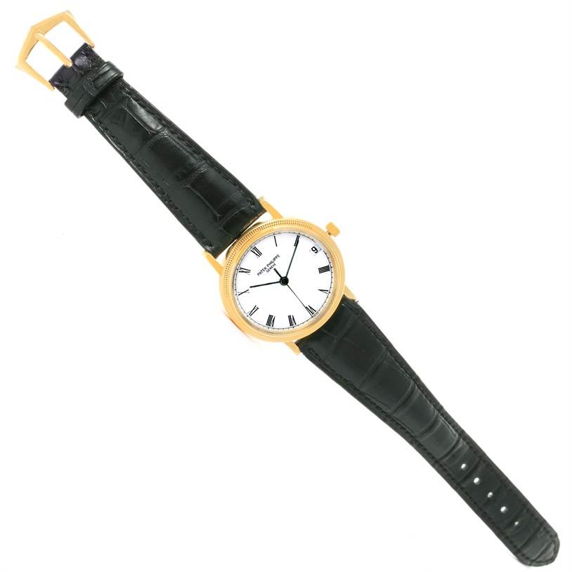 The image shows a top view of a Patek Philippe Calatrava 3802 Men's Yellow Gold White Dial 3802 Men's Yellow Gold White Dial watch, featuring the face, bezel, and full leather strap.