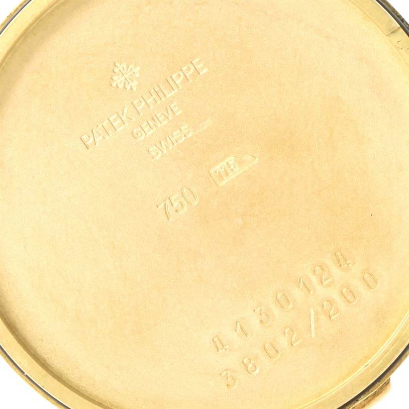 The image shows the backside of a Patek Philippe Calatrava 3802 Men's Yellow Gold White Dial 3802 Men's Yellow Gold White Dial watch case, featuring the brand engraving and model information.