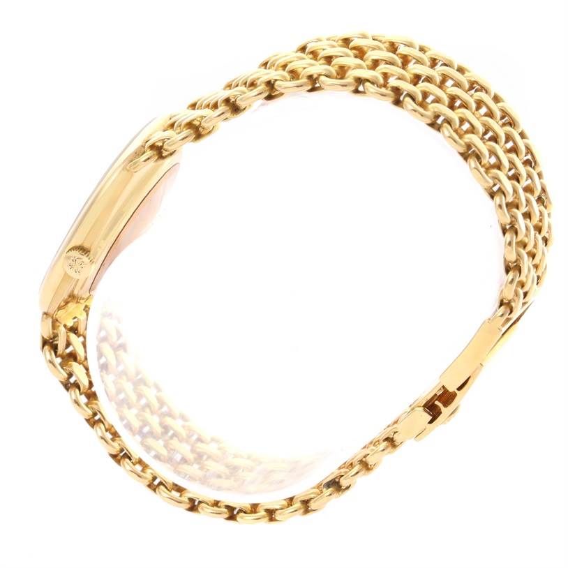 The image shows a side view of the Patek Philippe 3648 Yellow Gold Blue Dial 3648 Yellow Gold Blue Dial Golden Ellipse 18k Yellow Gold Blue Dial Watch 3648, highlighting its chain bracelet and clasp.