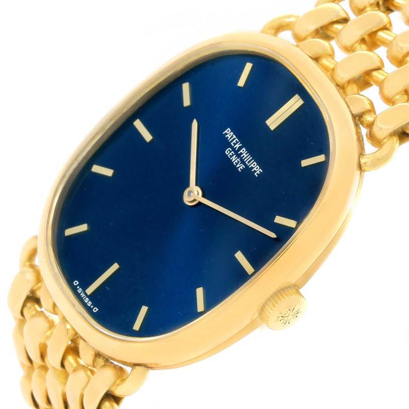 The image shows a close-up angled view of the dial, case, and bracelet of the Patek Philippe 3648 Yellow Gold Blue Dial 3648 Yellow Gold Blue Dial Golden Ellipse 18k Yellow Gold Blue Dial Watch 3648 model.
