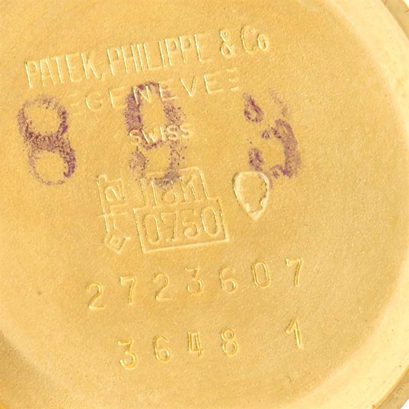 The image shows the back case of the Patek Philippe 3648 Yellow Gold Blue Dial 3648 Yellow Gold Blue Dial Golden Ellipse 18k Yellow Gold Blue Dial Watch 3648 model, displaying engravings and markings.