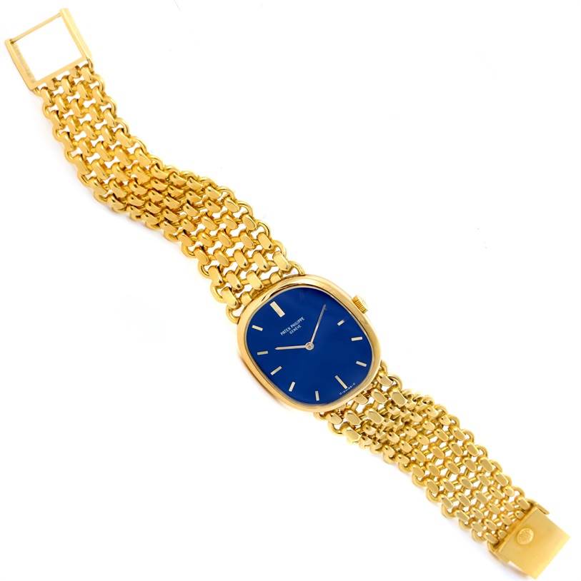 The Patek Philippe 3648 Yellow Gold Blue Dial 3648 Yellow Gold Blue Dial Golden Ellipse 18k Yellow Gold Blue Dial Watch 3648 is shown from a top-down angle, displaying its bracelet and dial.