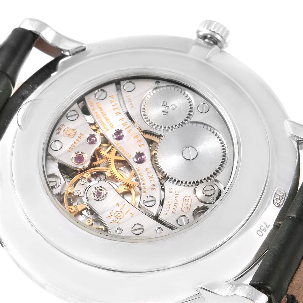 This image shows the open case back of the Patek Philippe Calatrava 5119G Men's White Gold White Dial 5119G Men's White Gold White Dial model, revealing its intricate mechanical movement.