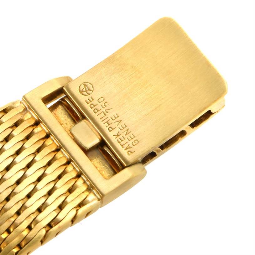The image shows the clasp of a Patek Philippe Golden Ellipse 3748 Men's Yellow Gold Blue Dial 3748 Men's Yellow Gold Blue Dial watch, focused on the branding and woven bracelet.