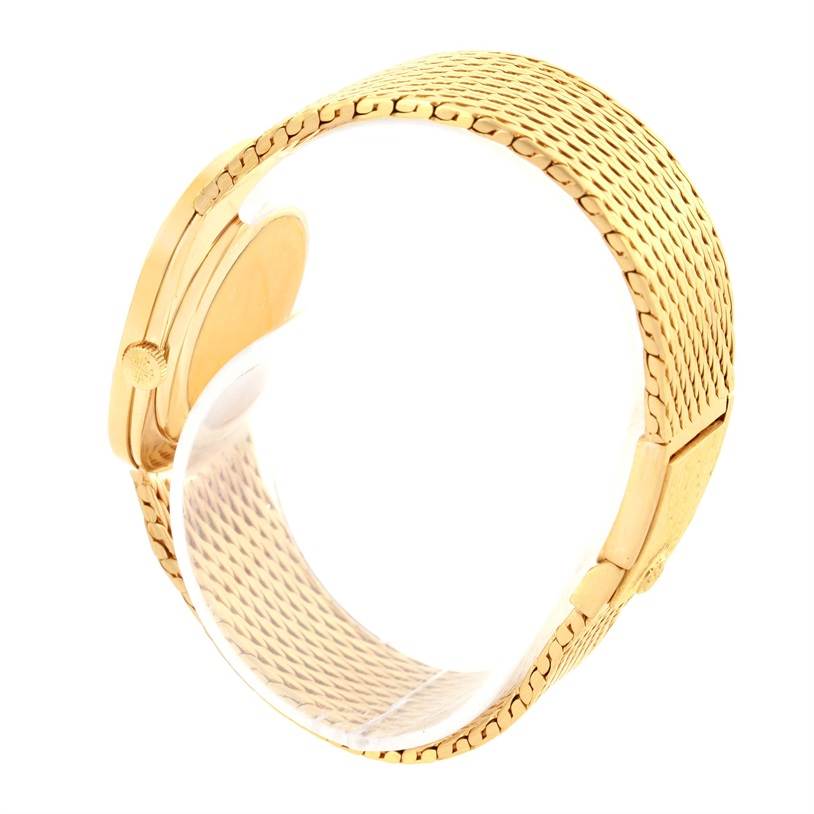 This image shows a side view of the Patek Philippe Golden Ellipse 3748 Men's Yellow Gold Blue Dial 3748 Men's Yellow Gold Blue Dial watch, focusing on the gold mesh bracelet and part of the case.