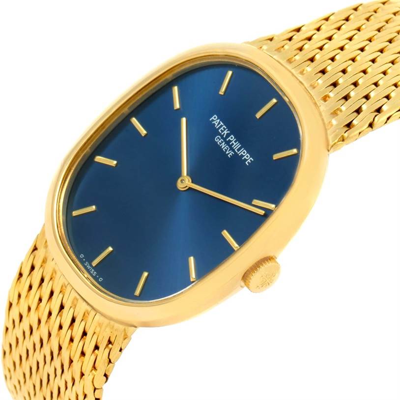 The image shows a close-up angle of the Patek Philippe Golden Ellipse 3748 Men's Yellow Gold Blue Dial 3748 Men's Yellow Gold Blue Dial model watch, including its blue dial, gold case, and gold mesh strap.