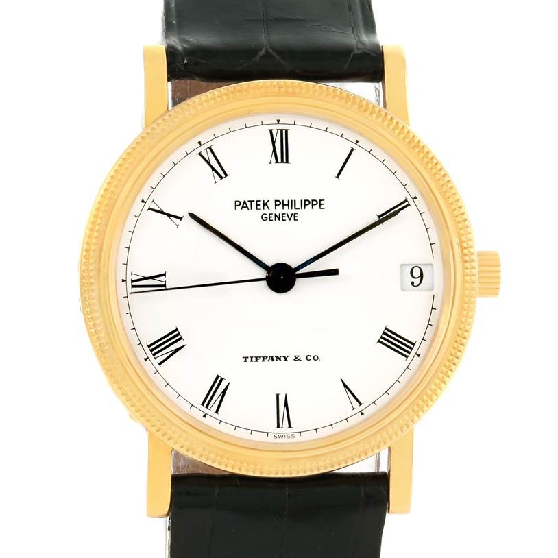 The Patek Philippe Calatrava 3802 Men's Yellow Gold White Dial 3802 Men's Yellow Gold White Dial watch is shown from a front angle, displaying its gold bezel, white dial, and black leather strap.