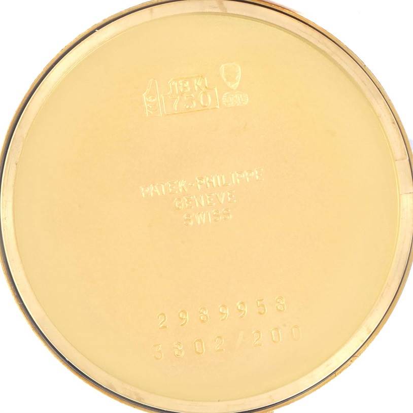 This is the inner case back of a Patek Philippe Calatrava 3802 Men's Yellow Gold White Dial 3802 Men's Yellow Gold White Dial watch, showing hallmarks and serial numbers.