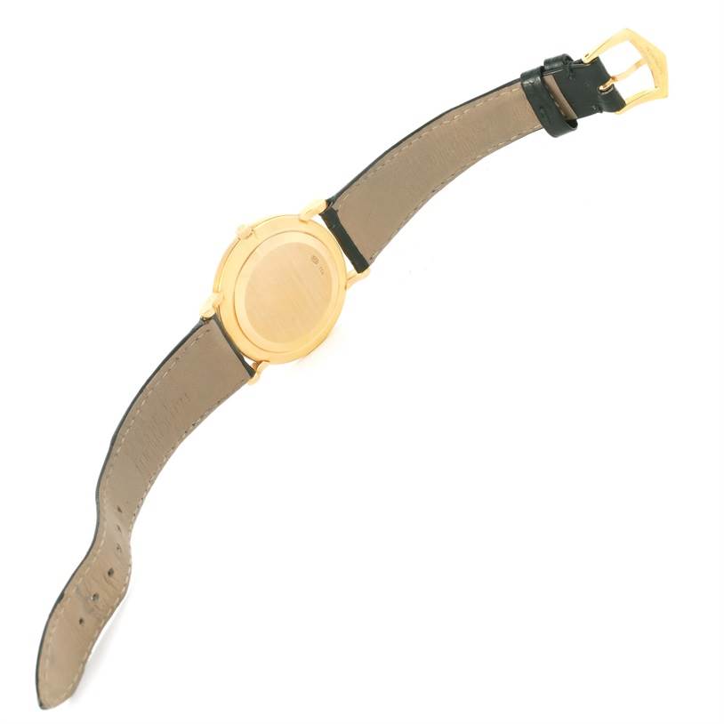 The image shows the back and straps of a Calatrava model watch by Patek Philippe, viewed from above.