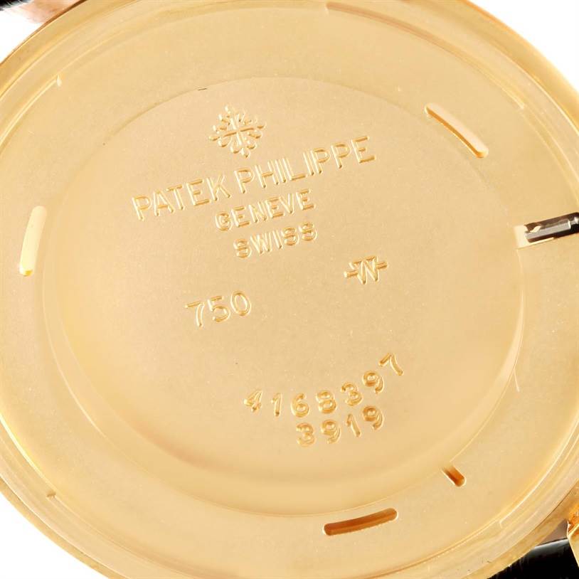 The image shows the interior case back of a Patek Philippe Calatrava 3919 Men's Yellow Gold White Dial 3919 Men's Yellow Gold White Dial watch, displaying the brand's inscription and model numbers.