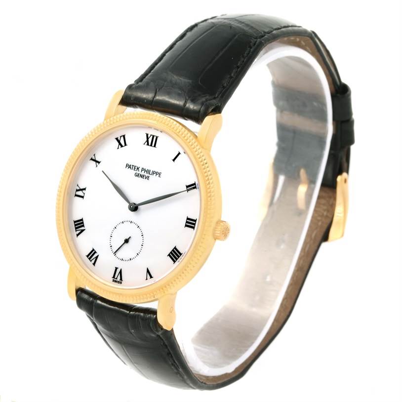 The Patek Philippe Calatrava 3919 Men's Yellow Gold White Dial 3919 Men's Yellow Gold White Dial watch is shown at an angled view, displaying its face, hands, bezel, and leather strap.