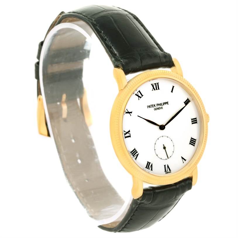 The image shows a Patek Philippe Calatrava 3919 Men's Yellow Gold White Dial 3919 Men's Yellow Gold White Dial watch from a three-quarter angle, highlighting its face and black leather strap.
