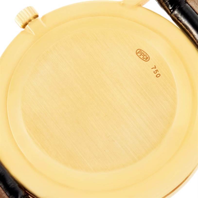 This image shows the back case and crown of a Patek Philippe Calatrava 3919 Men's Yellow Gold White Dial 3919 Men's Yellow Gold White Dial watch.