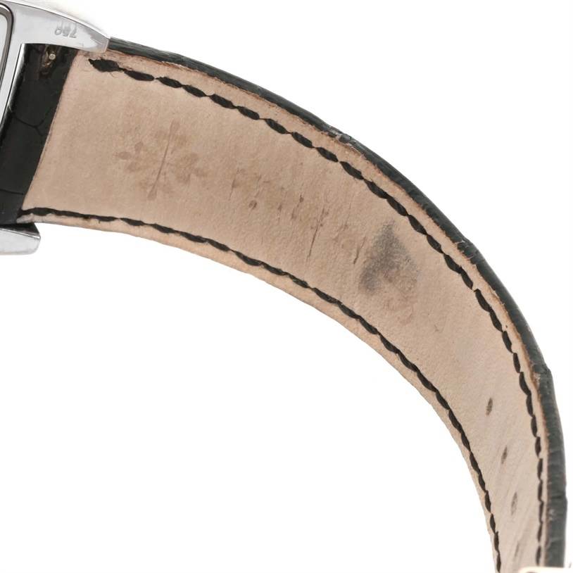 The image shows a close-up of the strap and part of the clasp of a Patek Philippe Gondolo 5135G Men's White Gold Black Dial 5135G Men's White Gold Black Dial watch.