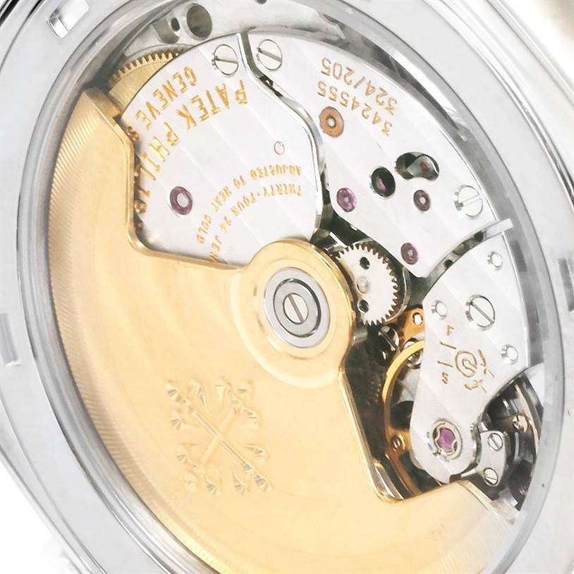 This image shows a close-up view of the movement mechanism of the Patek Philippe Gondolo 5135G Men's White Gold Black Dial 5135G Men's White Gold Black Dial watch.
