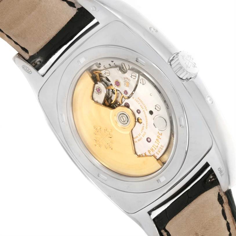The image shows the back view of the Patek Philippe Gondolo 5135G Men's White Gold Black Dial 5135G Men's White Gold Black Dial watch, displaying its inner mechanical movement.