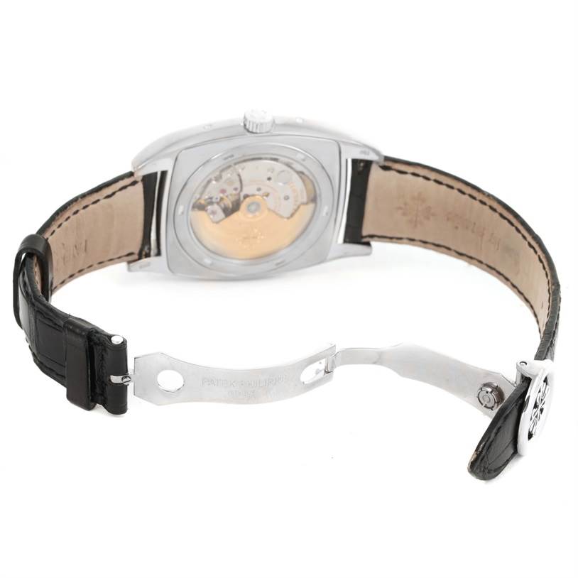 This image shows the back view of the Patek Philippe Gondolo 5135G Men's White Gold Black Dial 5135G Men's White Gold Black Dial watch, highlighting the transparent case back and open clasp.