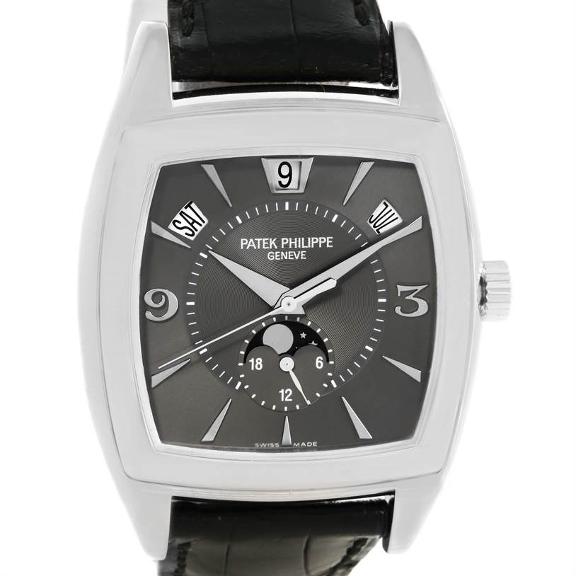 The image shows a close-up view of the Patek Philippe Gondolo 5135G Men's White Gold Black Dial 5135G Men's White Gold Black Dial watch, displaying the dial, hands, and part of the strap.