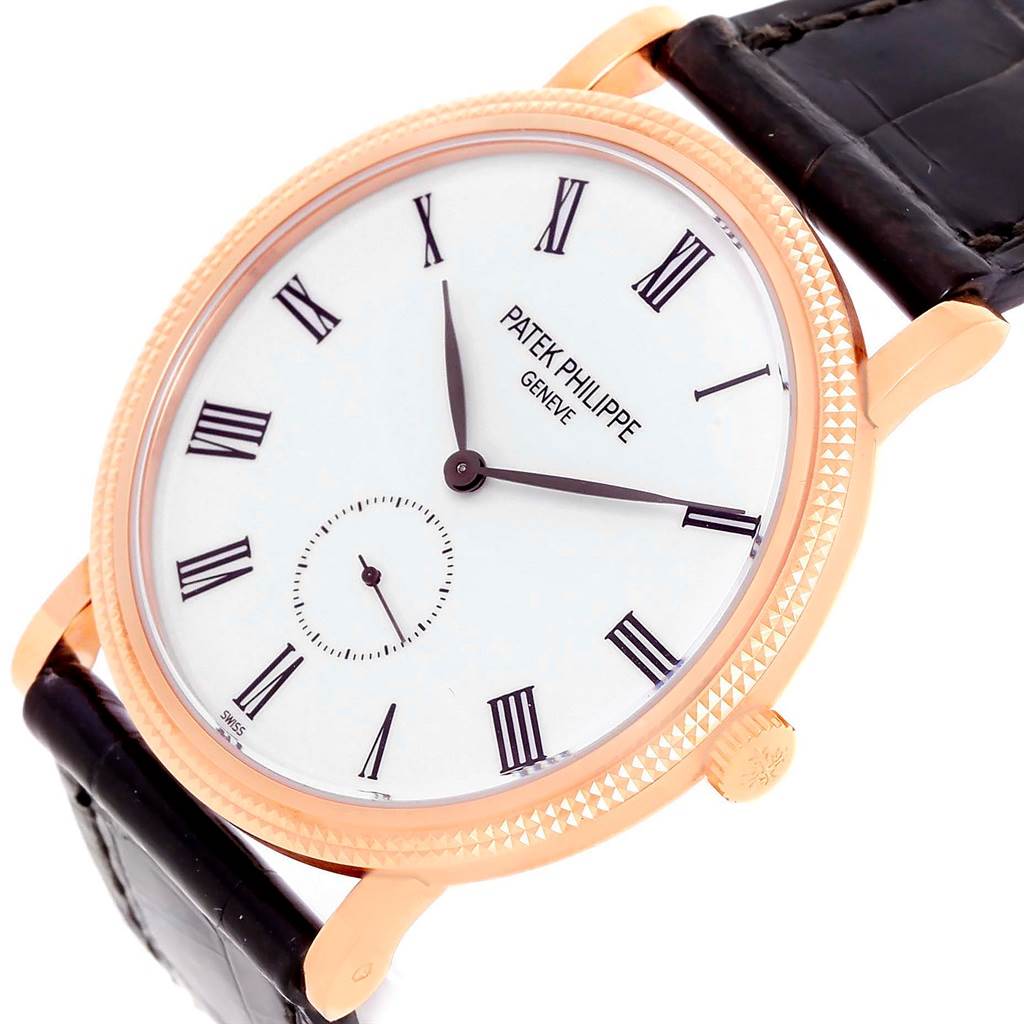 The image shows a Calatrava watch by Patek Philippe from a slightly tilted top-down angle, highlighting the dial, bezel, and part of the strap.