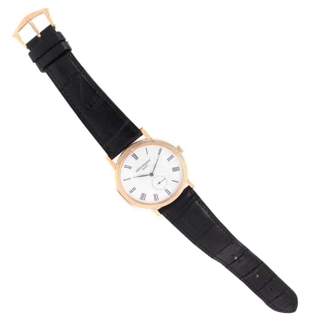 This is a top-down view of a Patek Philippe Calatrava 5119 Men
s Rose Gold White Dial 5119 Men
s Rose Gold White Dial watch showing the face, black leather strap, and gold buckle.