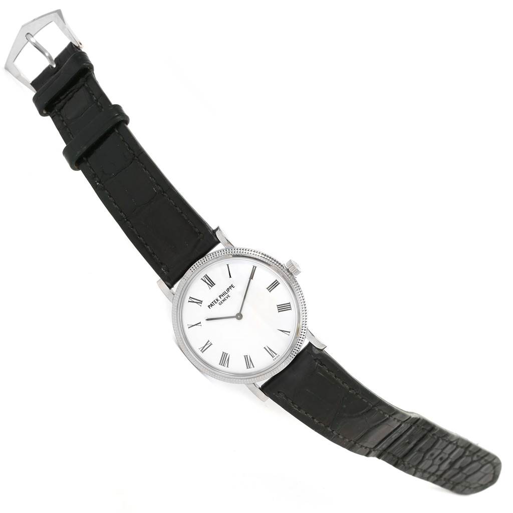 The image shows a Patek Philippe Calatrava 5120G Men's White Gold White Dial 5120G Men's White Gold White Dial watch at a slight diagonal angle, displaying the face, strap, and buckle.