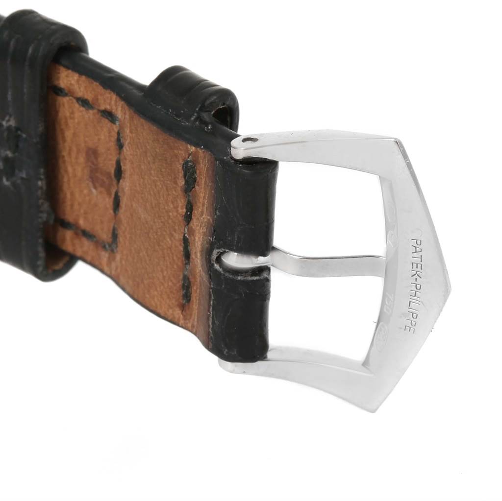 The image shows a close-up of the buckle and part of the leather strap of a Patek Philippe Calatrava 5120G Men's White Gold White Dial 5120G Men's White Gold White Dial watch.