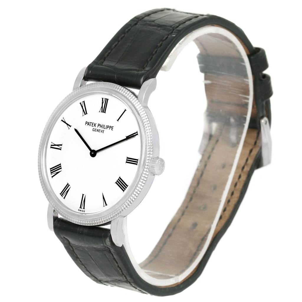 This image shows the Patek Philippe Calatrava 5120G Men's White Gold White Dial 5120G Men's White Gold White Dial watch at a three-quarter angle, displaying its face, crown, and black leather strap.