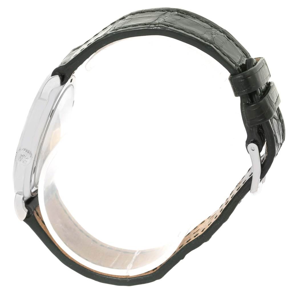 This side view of the Patek Philippe Calatrava 5120G Men's White Gold White Dial 5120G Men's White Gold White Dial watch shows the case and leather strap.