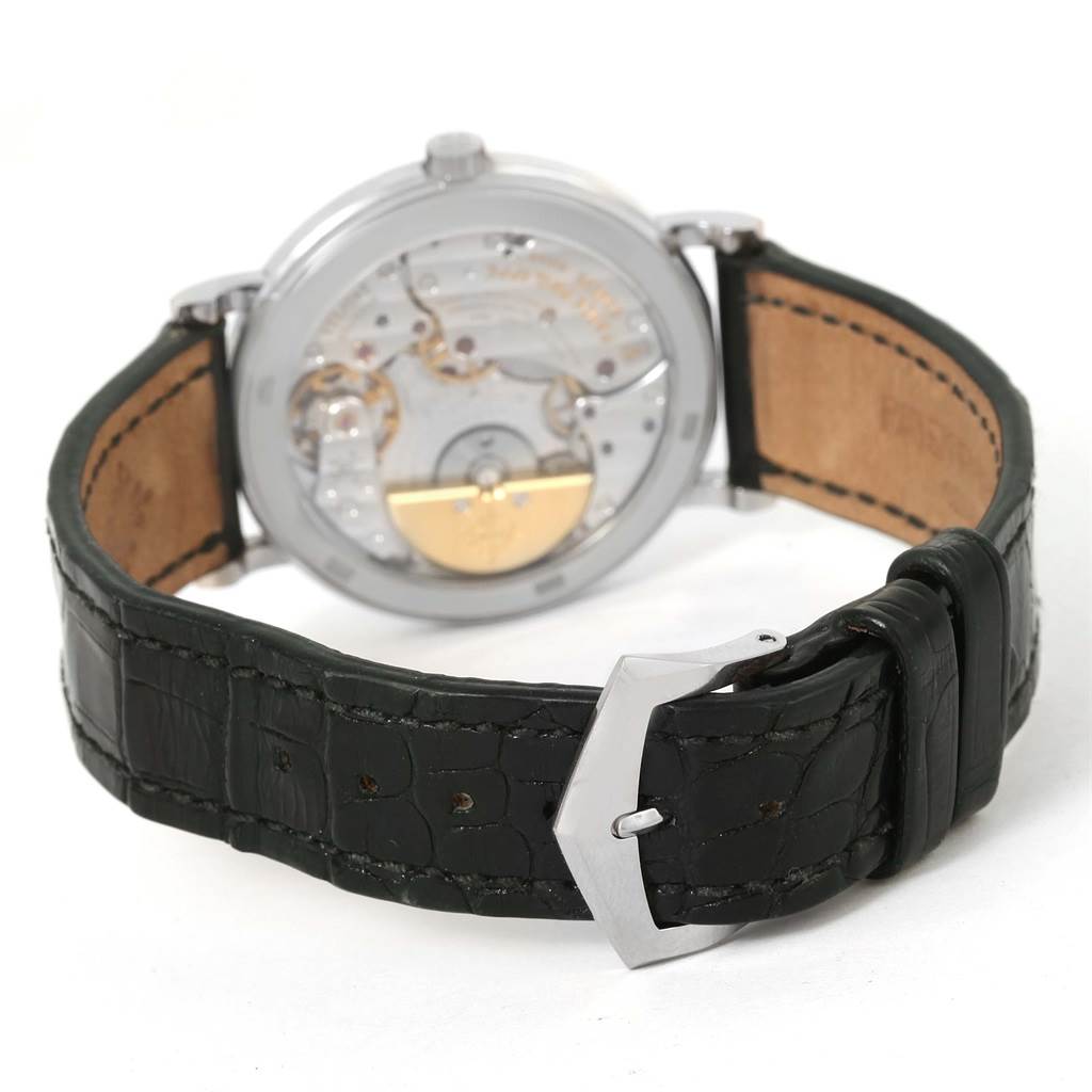 The image shows the back view of a Patek Philippe Calatrava 5120G Men's White Gold White Dial 5120G Men's White Gold White Dial watch, highlighting the movement and leather strap.