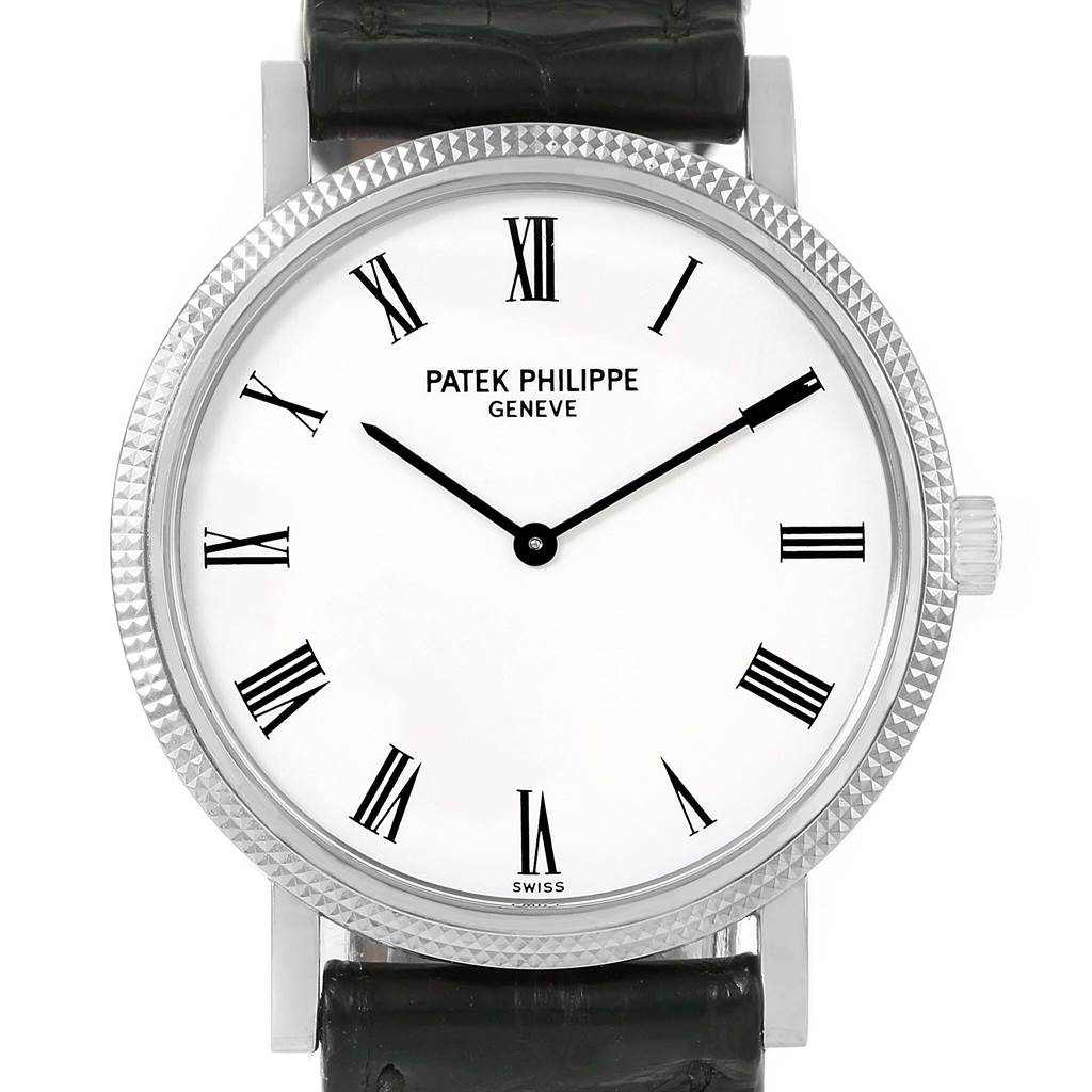 The image shows a Patek Philippe Calatrava 5120G Men's White Gold White Dial 5120G Men's White Gold White Dial watch with a front view highlighting its face, bezel, and strap connection.